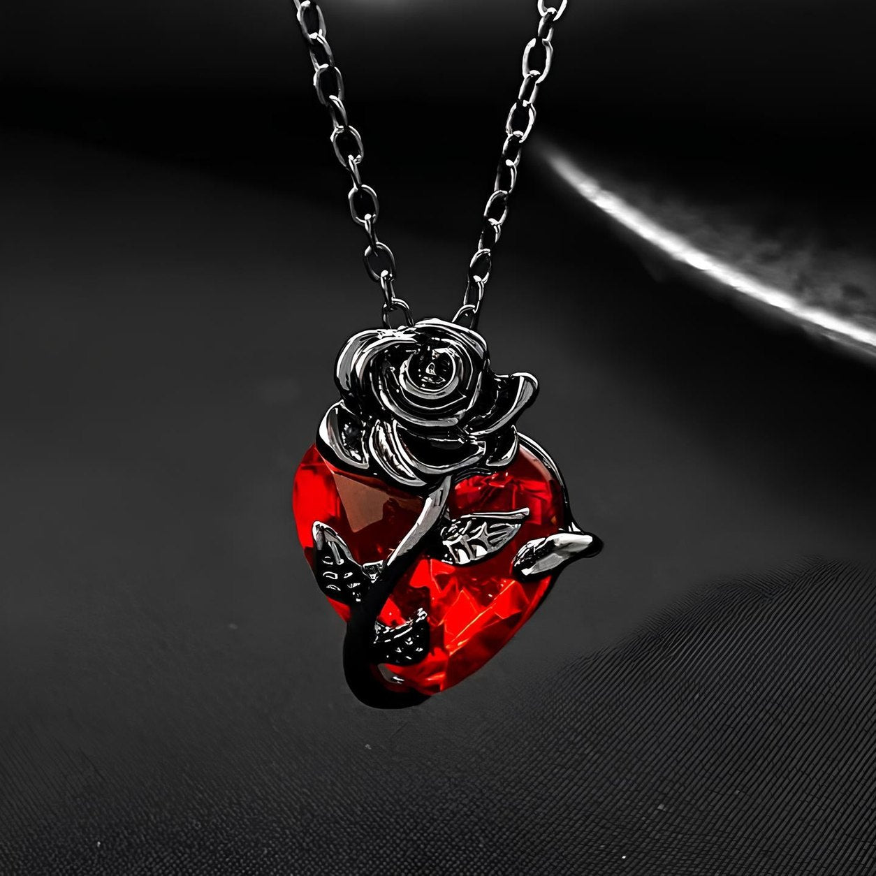 Close up of the sculpted rose at the top of the faceted red heart