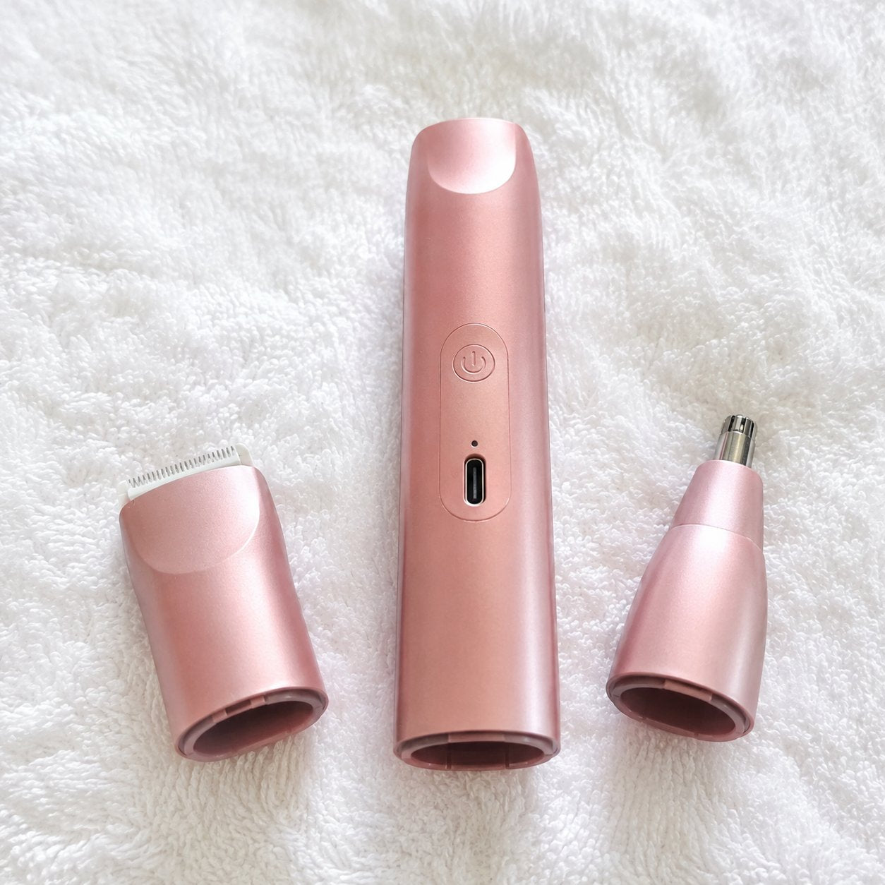 The Pomence 2-in-1 Bikini Trimmer taken apart into its body and two heads