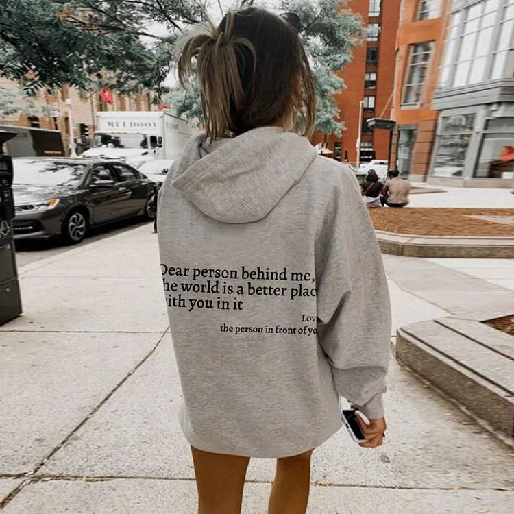 Dear Person Behind Me sweatshirt in grey on a city street