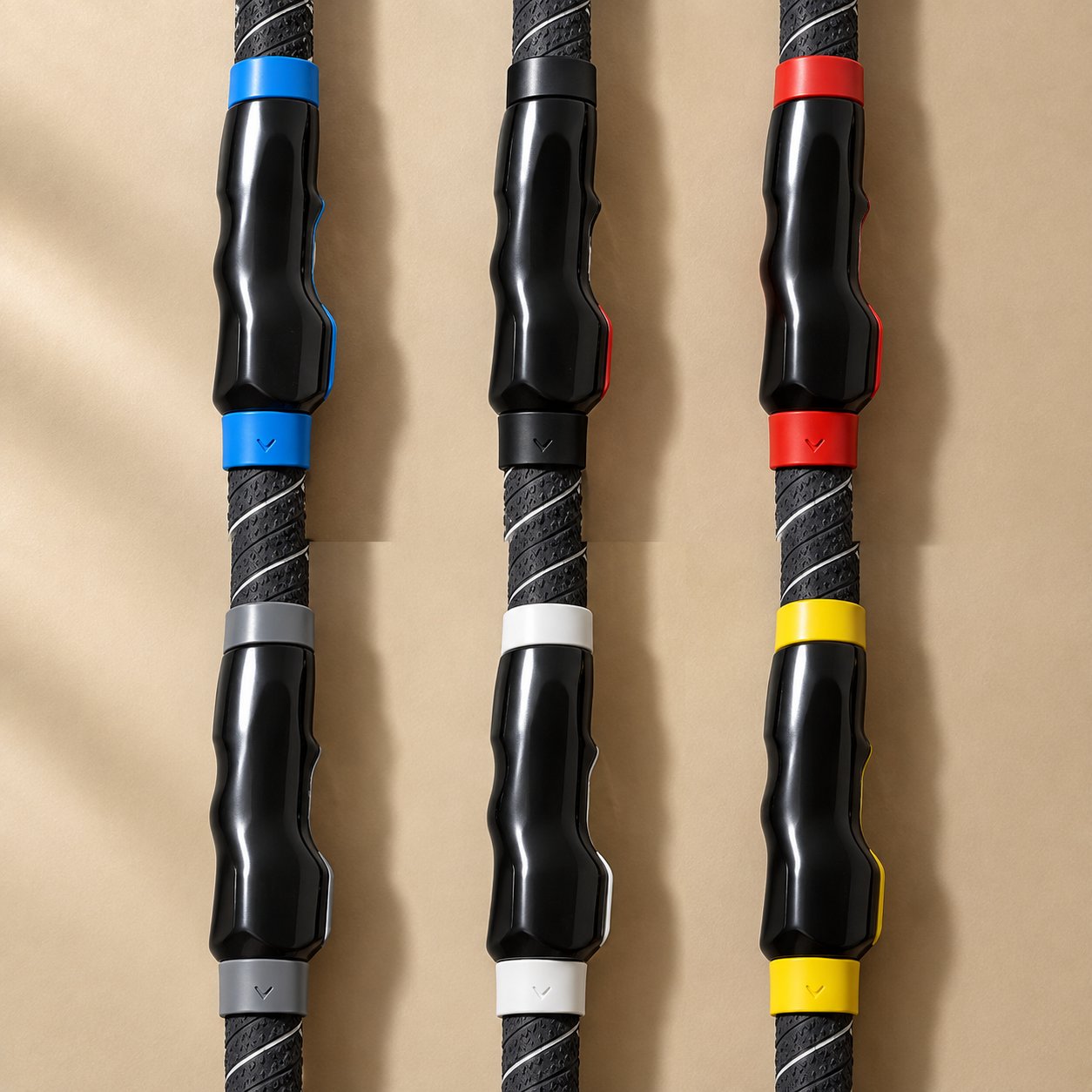 The six colorways of the Pomence Golf Grip Trainer, blue, black, red, gray, white and yellow