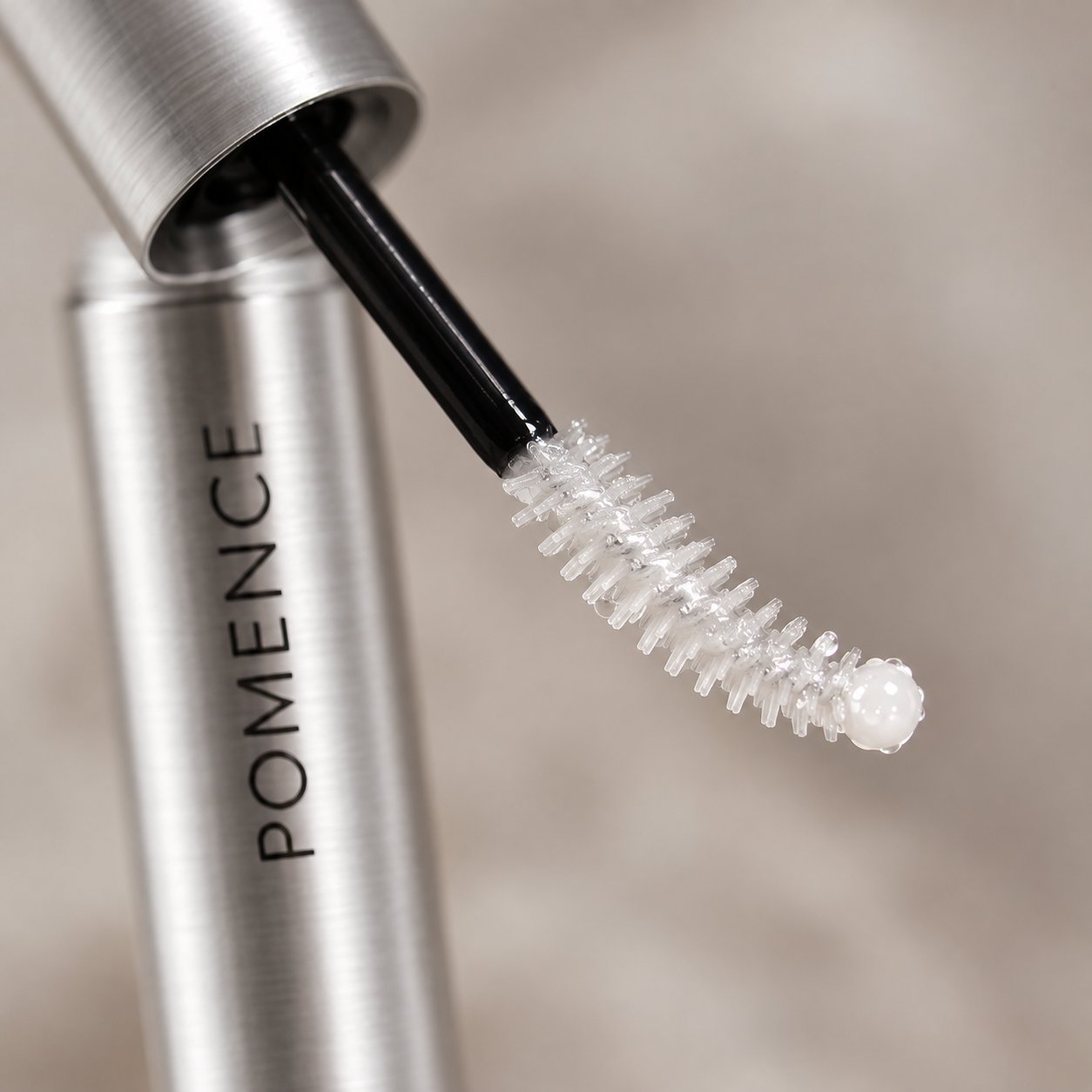 Macro of the small white ball tip of the Pomence serum wand