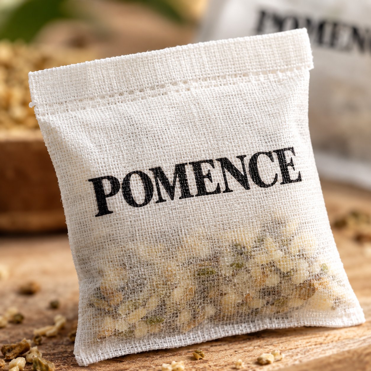 Macro of the plant-oil granules inside an open white Pomence sachet