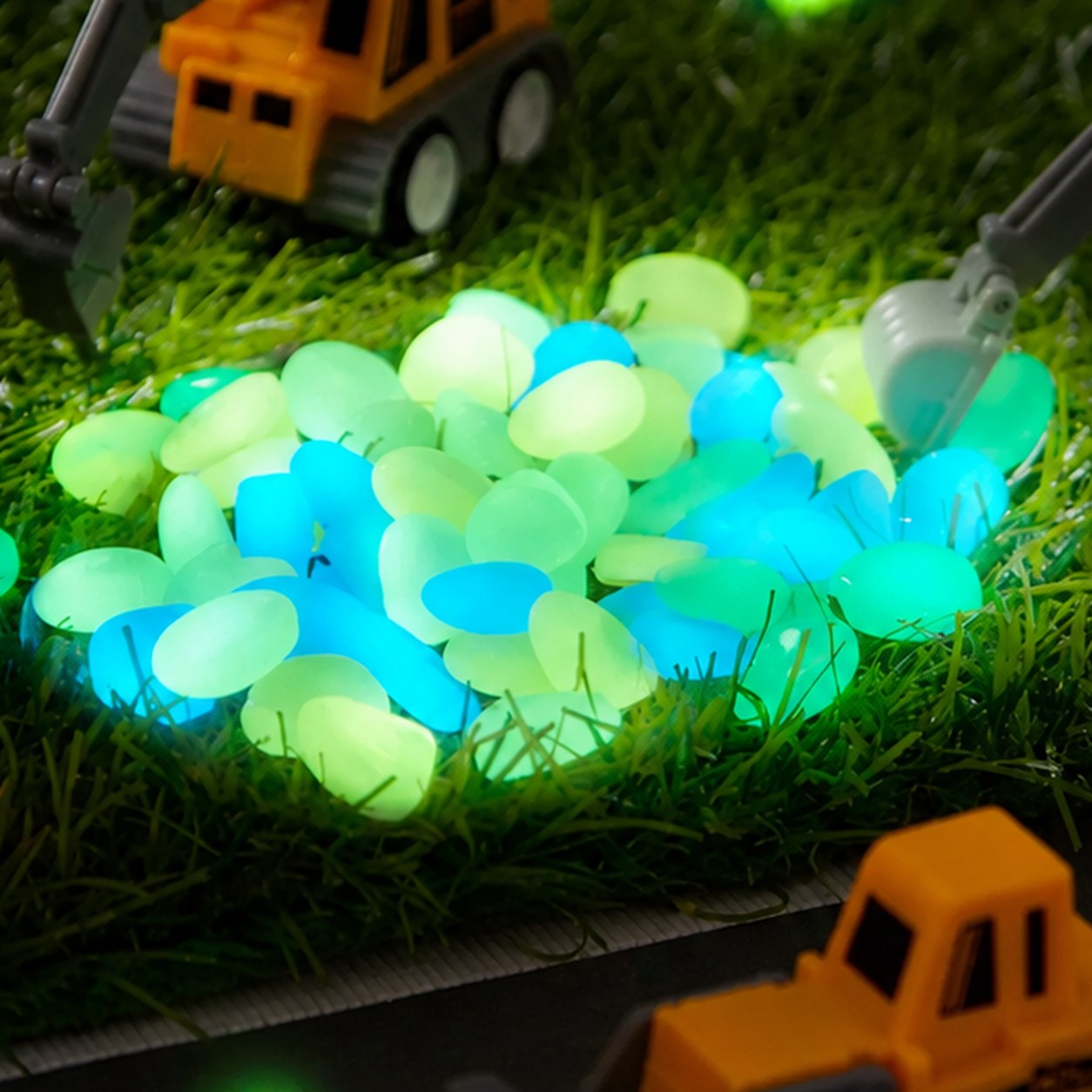 A pile of glow-in-the-dark stones glowing green and blue