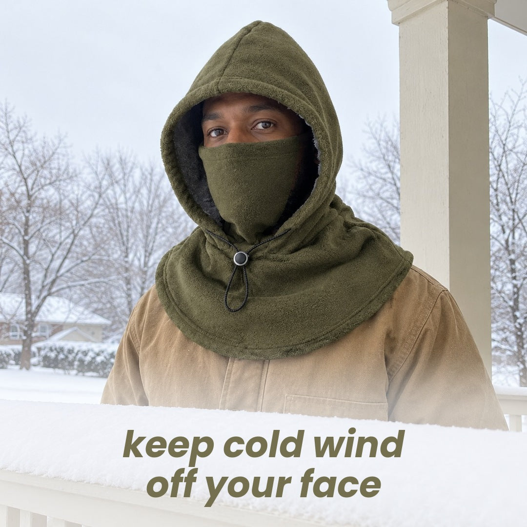 keep cold wind off your face: a man in the green hood with the face cover up on a snowy porch