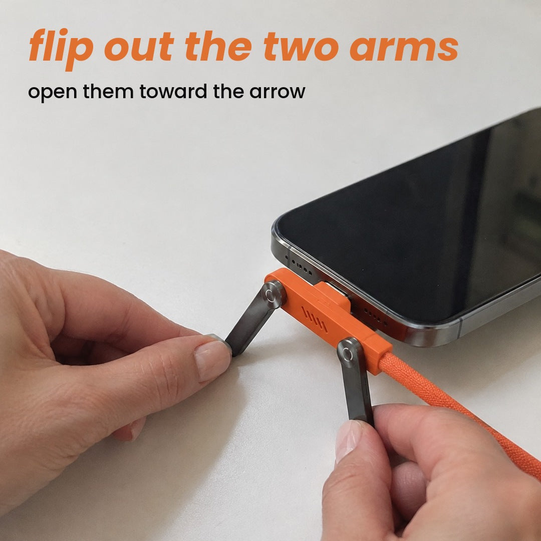 flip out the two arms: open them toward the arrow
