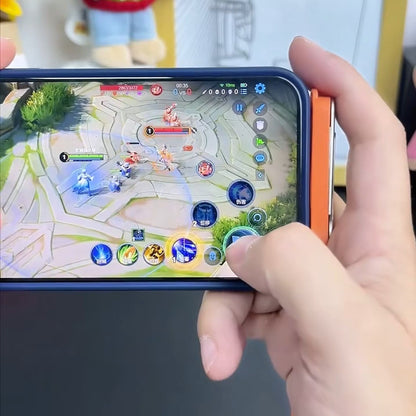 real frame: a hand holding a phone in a blue case sideways mid-game, the orange angled plug seated flat on its short edge