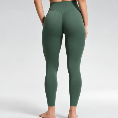 Back view of Dark Forest Green leggings, the V line from the waistband, contoured back, no ruching