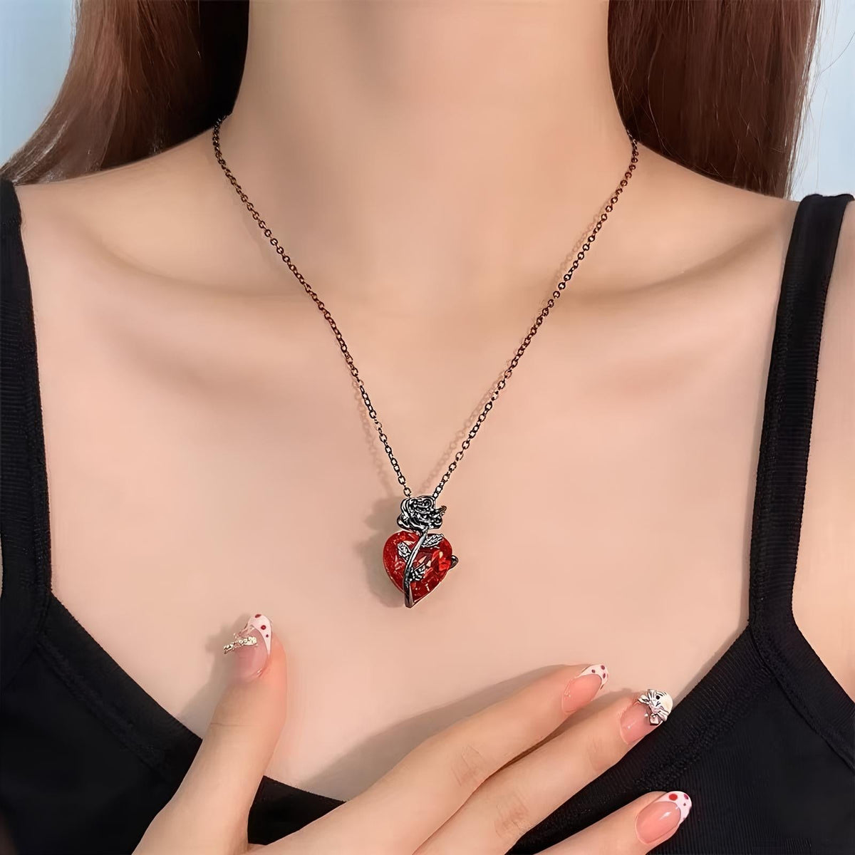 Pomence Blood Rose Necklace in Black worn at the collarbone with a black top