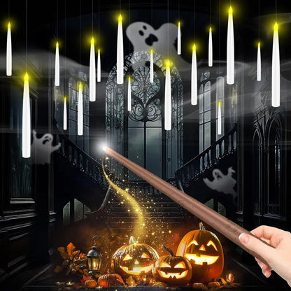 Pomence LED Floating Candles glowing in the air above carved pumpkins, switched on with the wand remote