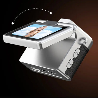 The Pomence Mini Keychain Camera with its screen flipped up 180 degrees for a selfie