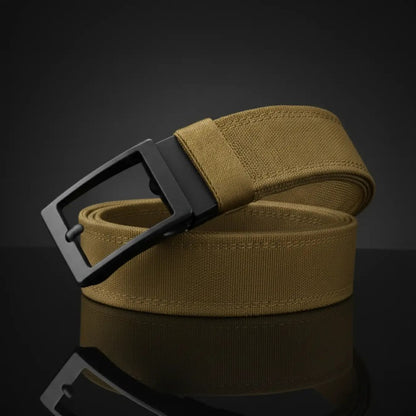The Pomence Ratchet Tactical Belt in Tan, coiled packshot with the matte black metal buckle