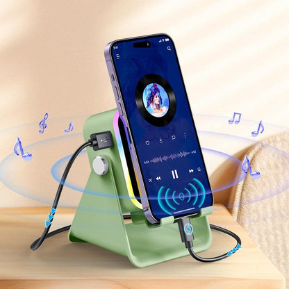 The sage green Pomence Speaker Phone Stand with a phone playing music on it