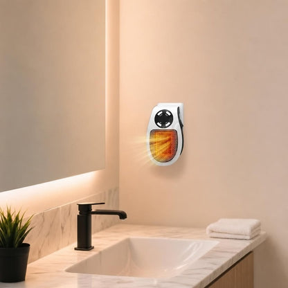 The Pomence Wall Outlet Heater plugged in above a bathroom counter beside the sink