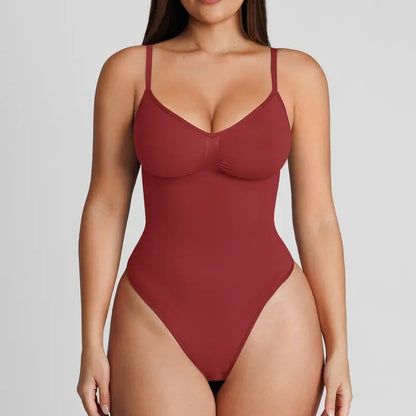 The product's own listing photo: the pale red violet thong bodysuit on the body, cropped torso, front view.