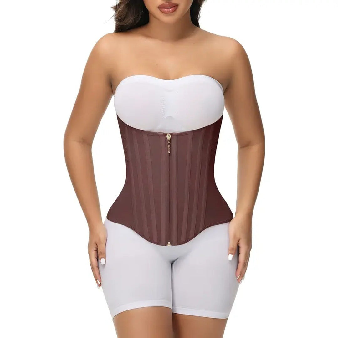 Model from the front in the mocha corset over a white bandeau and bike shorts, white space on both sides.