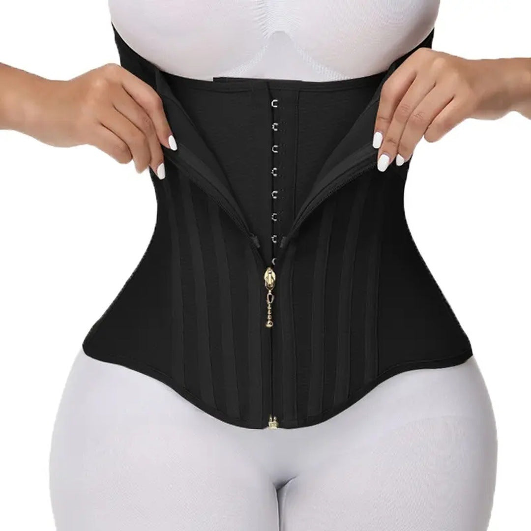 The black corset worn on the torso, hands opening the zipper to show the hooks inside.