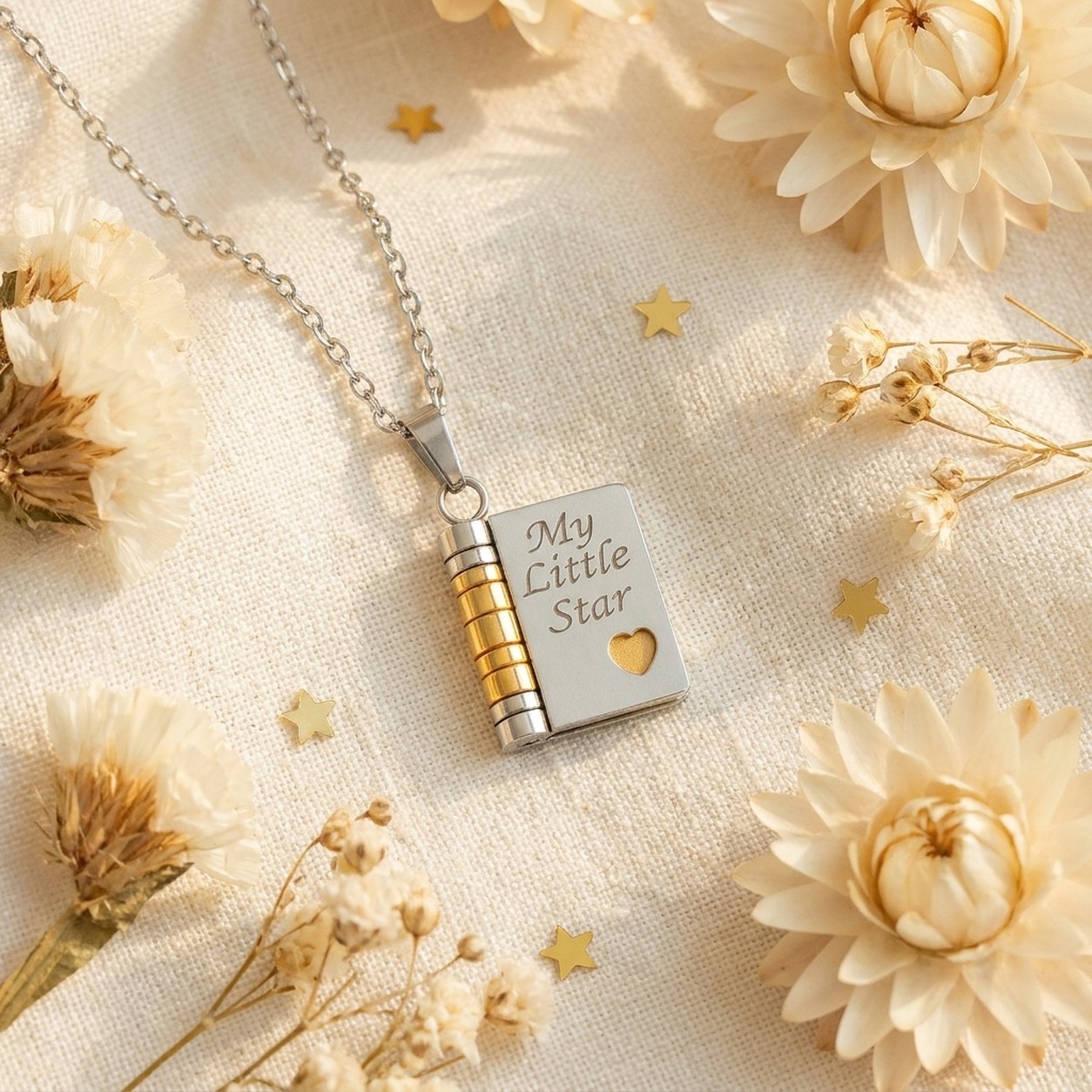 The Pomence My Little Star Book Locket Necklace on its chain, laid flat