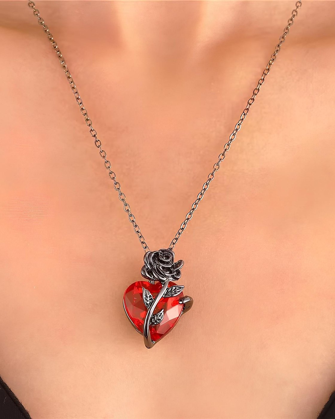 The Pomence Blood Rose Necklace worn, the pendant sitting just below the collarbone