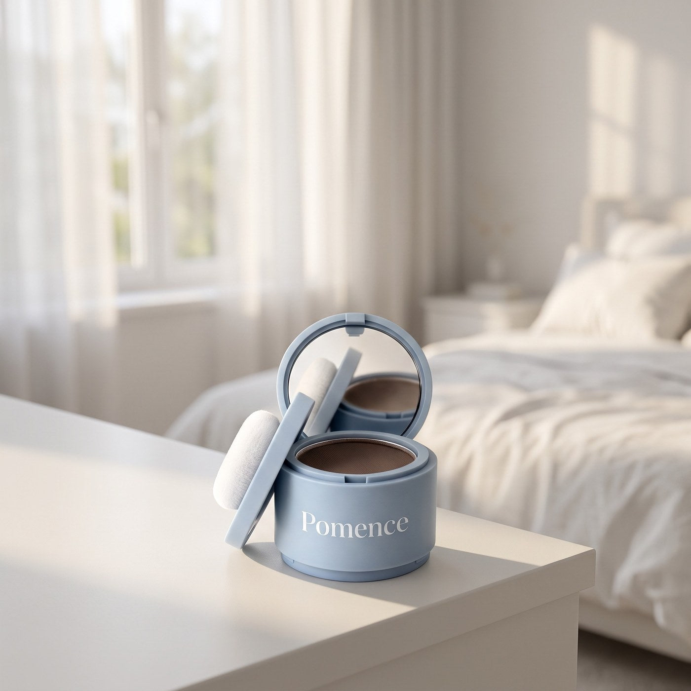 Pomence hairline powder compact on a bedside table