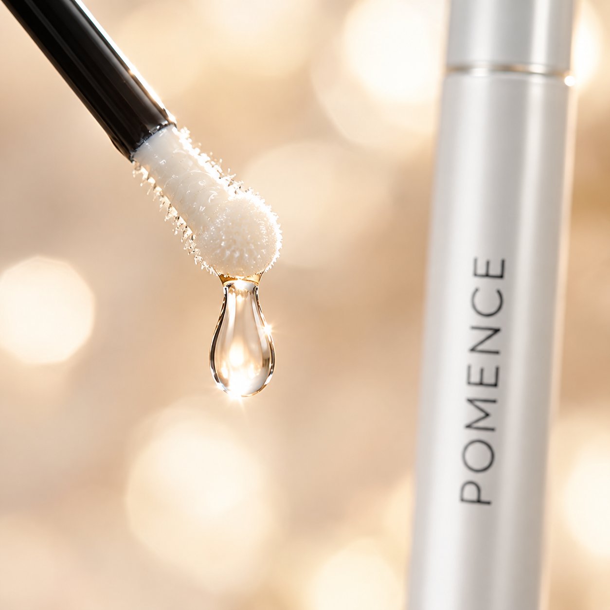 Macro of a drop of clear Pomence lash serum