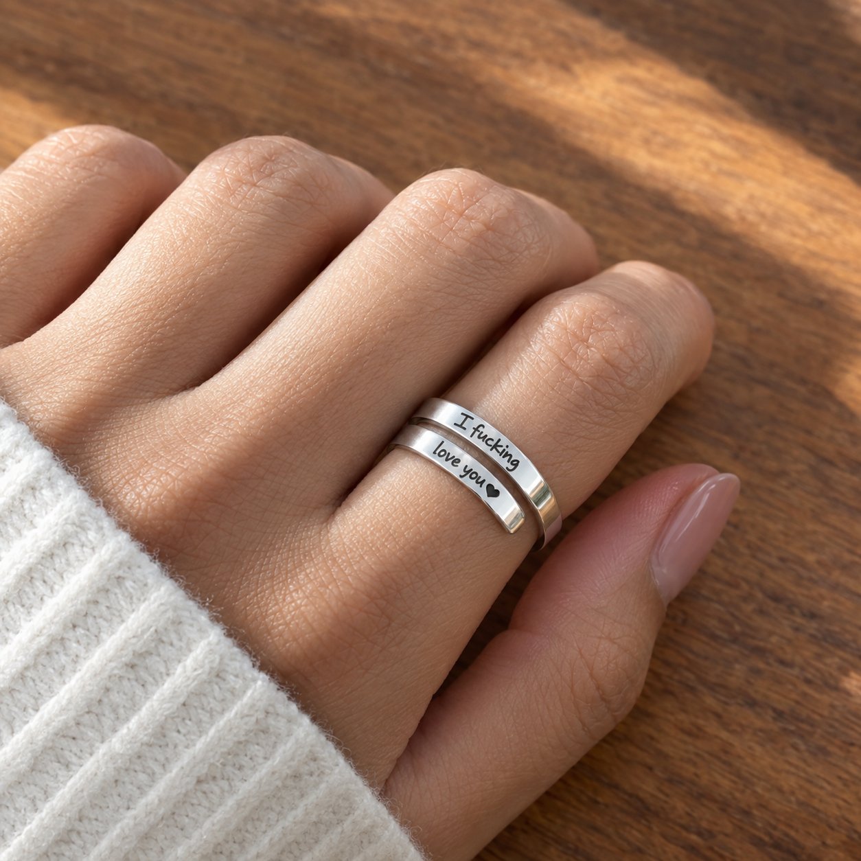 The Pomence I F♡cking Love You Ring worn on an adult hand with both engraved lines facing the camera