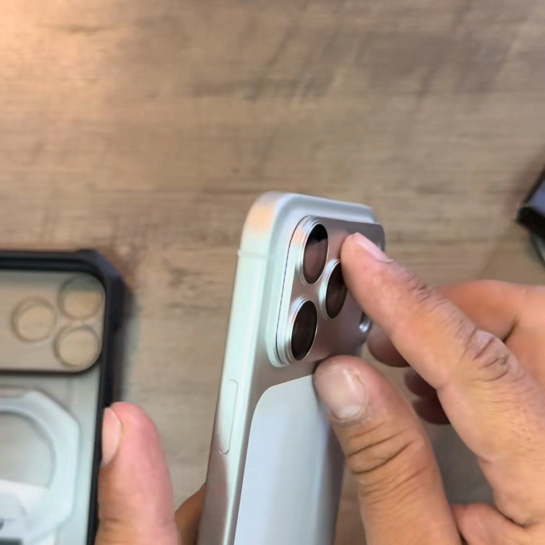 Hands setting the cover on a Silver iPhone camera