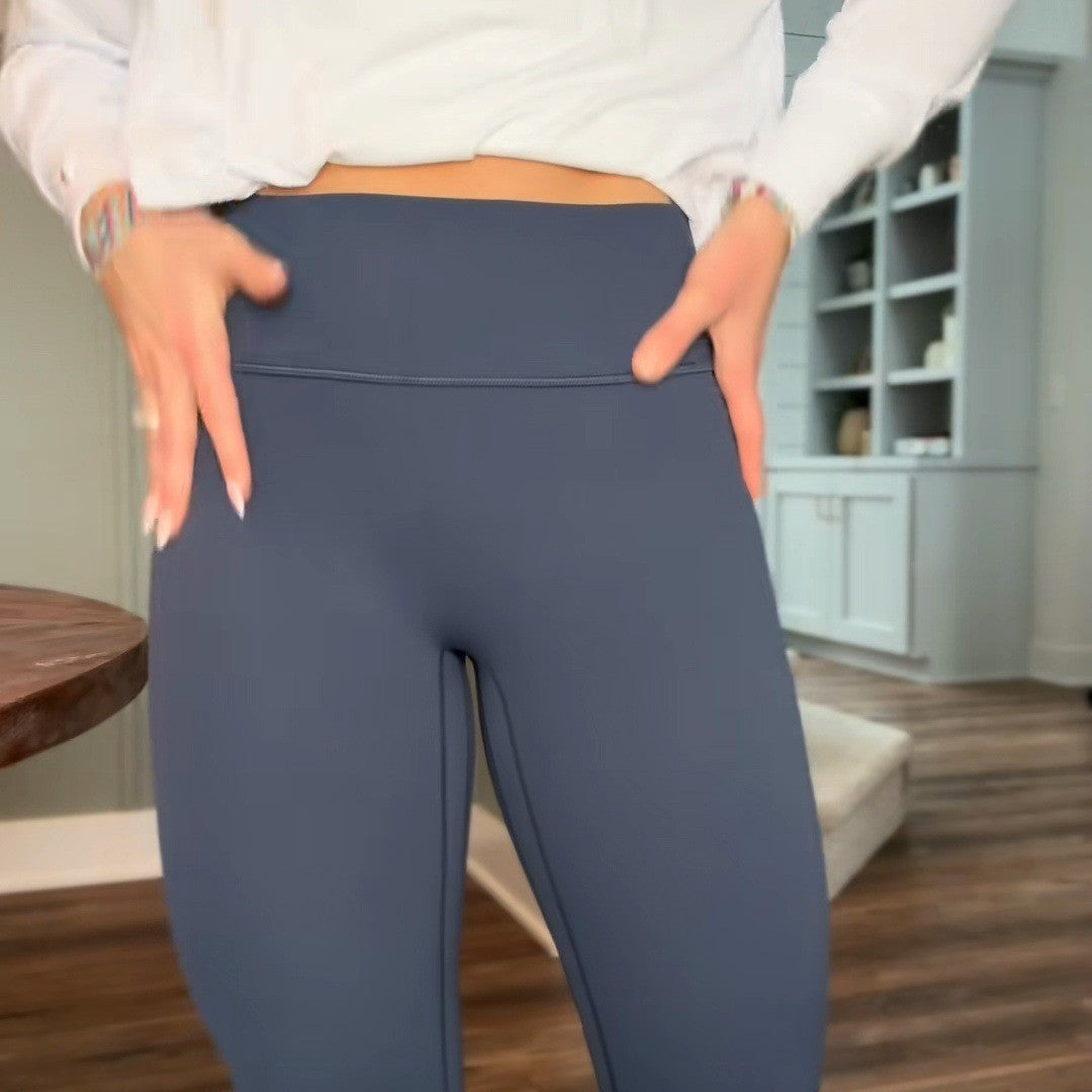 Smooth high waistband front with a white sweater lifted