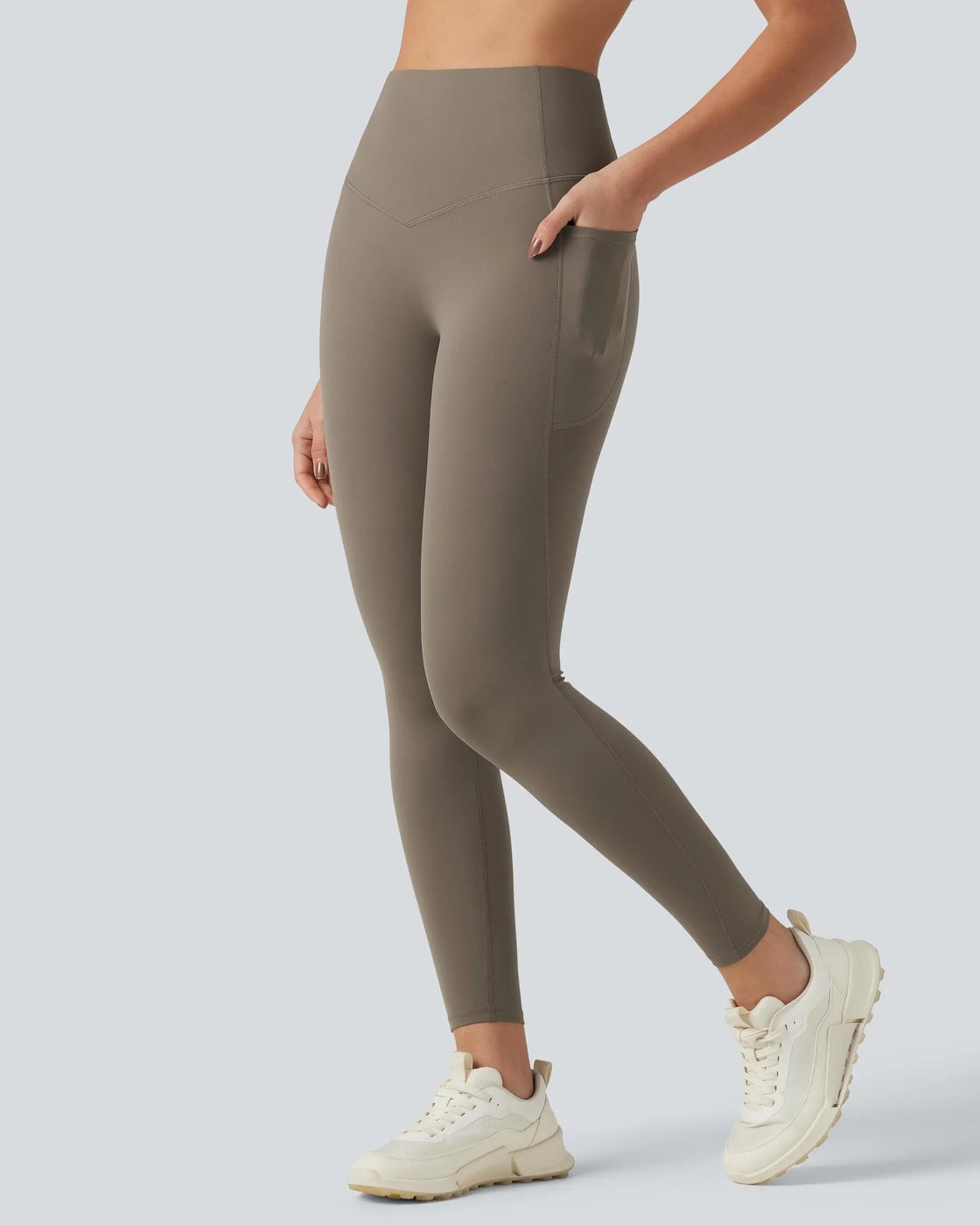 Side view of a woman walking in the Pomence high waisted tummy control sculpt leggings