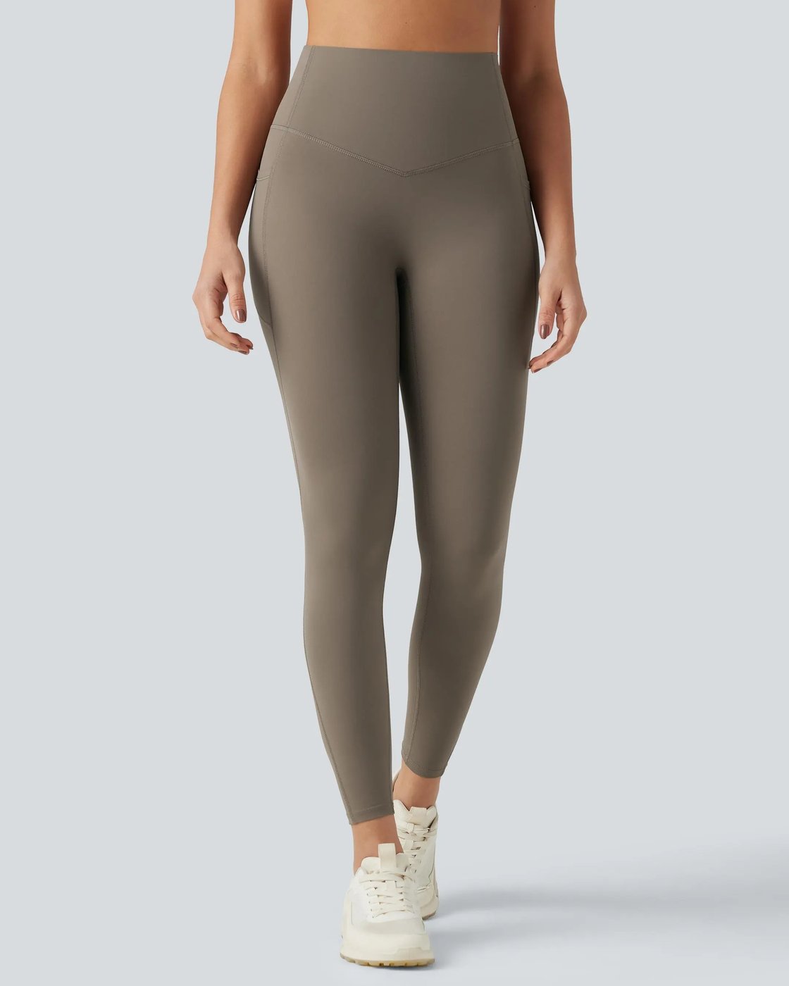 Front view of a woman in the Pomence high waisted tummy control sculpt leggings showing the high waistband
