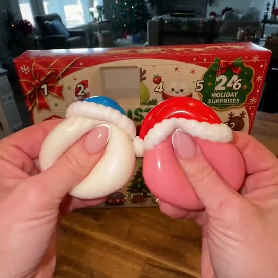 Two hands squeezing a white and a pink Santa squishy