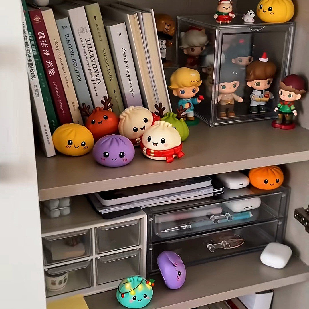 Squishies lined up on a home bookshelf among books