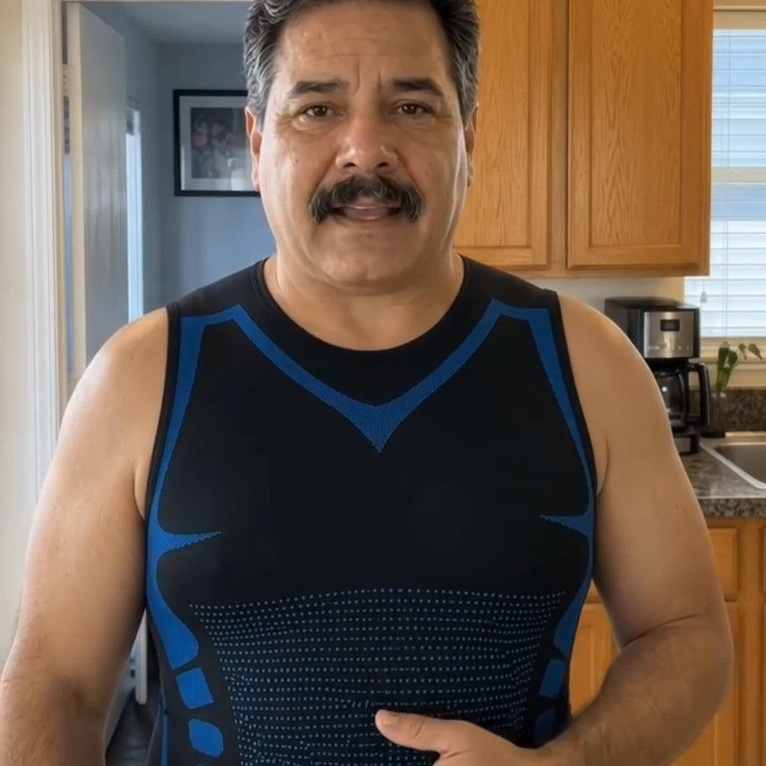 Mustached man in his kitchen wearing the blue-trim tank