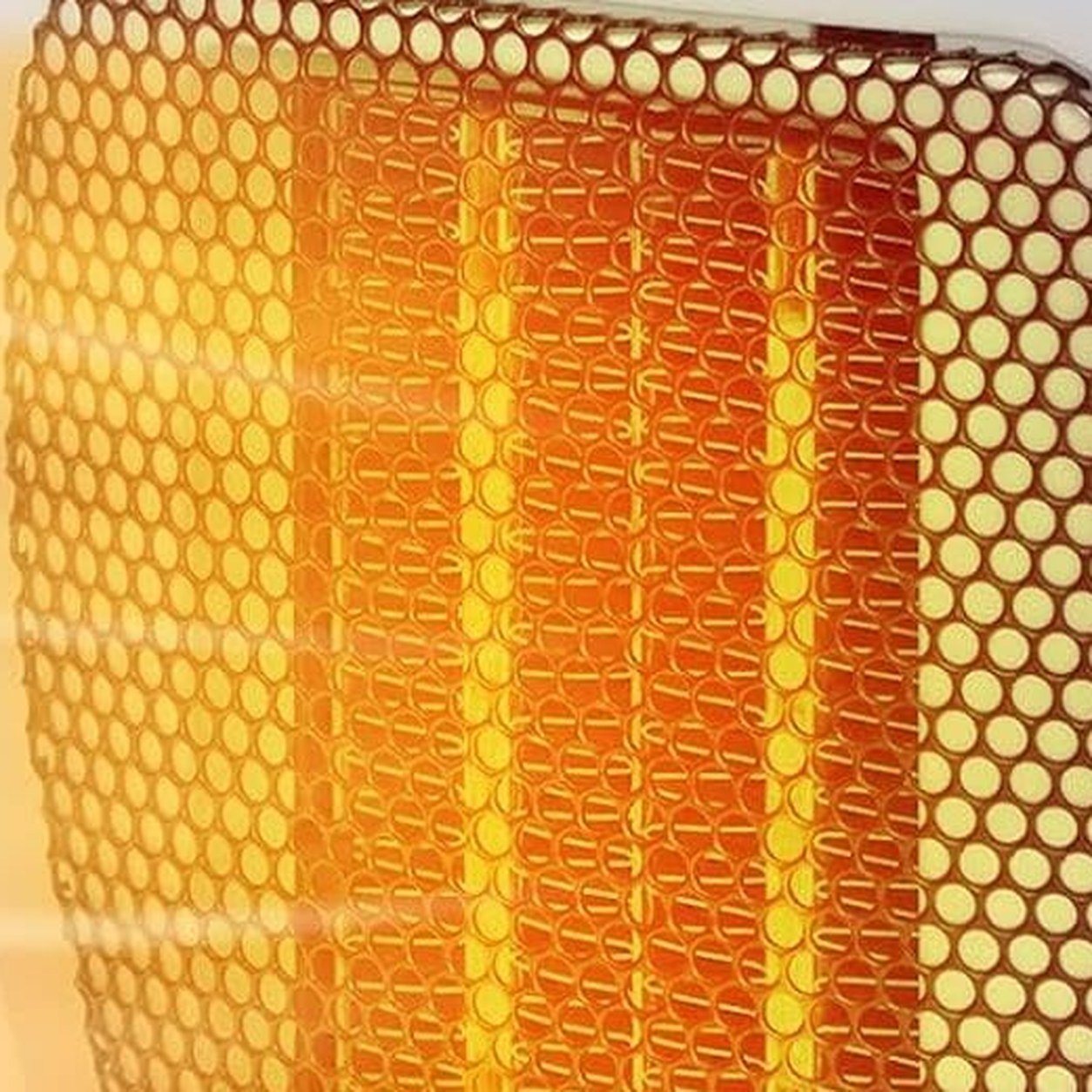 The ceramic heating element glowing orange